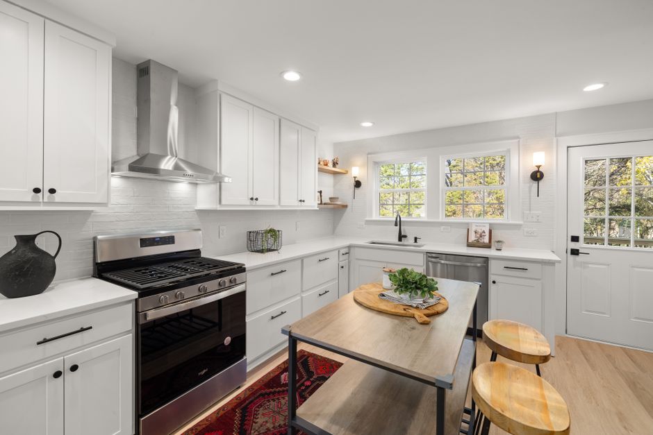 Bright contemporary kitchen with stainless steel appliances and a central island.